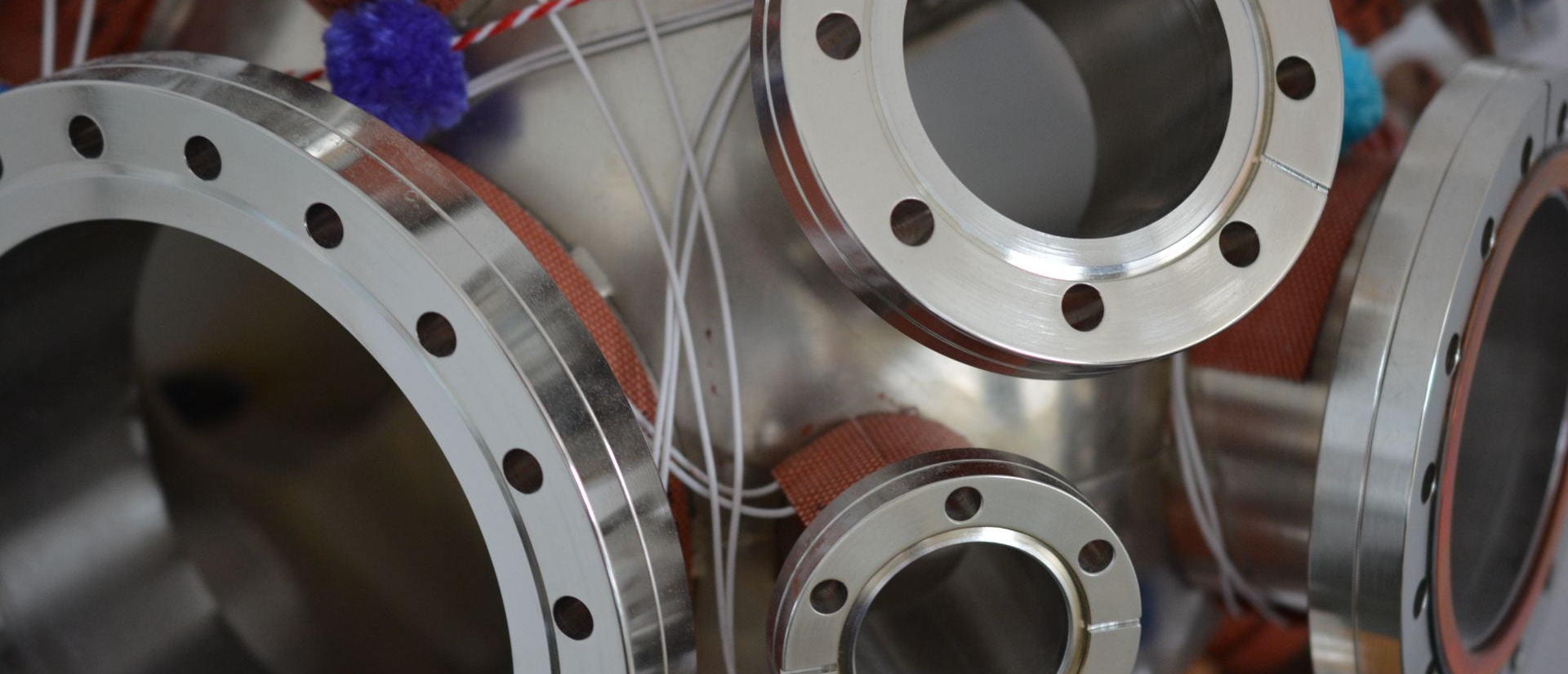 Close-up of a metal object featuring various types of valves, showcasing intricate details and mechanisms.
