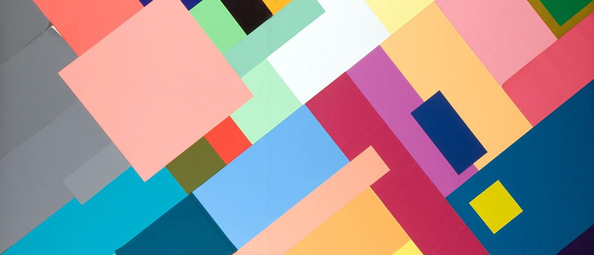 Abstract painting featuring vibrant squares and rectangles in various colors, creating a dynamic visual composition.